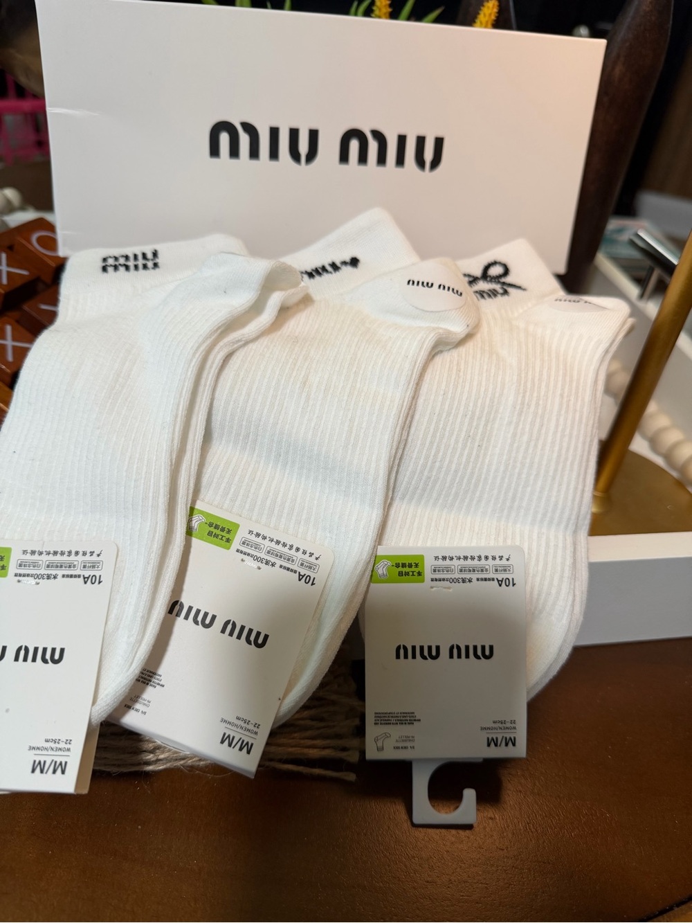 MIU MIU White Ankle Socks with Black Logo Accents